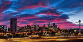 a panoramic shot of denver city at night, one of the best places to retire in the us