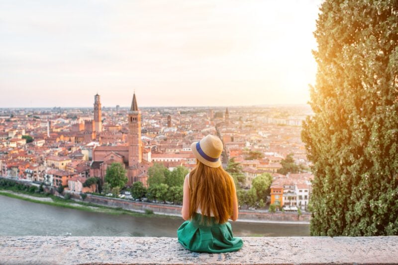 Woman enjoying beautiful view on Verona city while living abroad