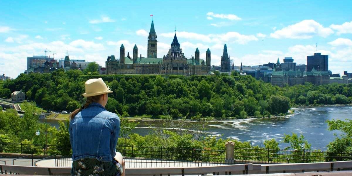 A woman overlooking a city in Canada, one of the safest places to live in the world