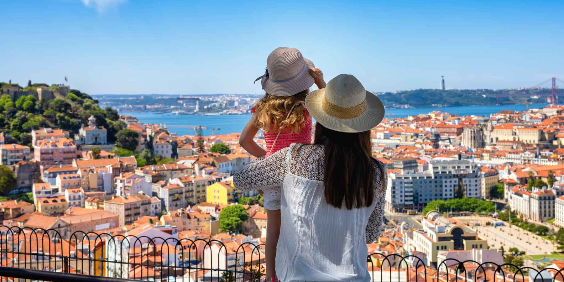 a mother and her daughter enjoying the view of the beautiful cityscape of Lisbon, ones of the best places to live in Europe and one of the safest places to live in the world