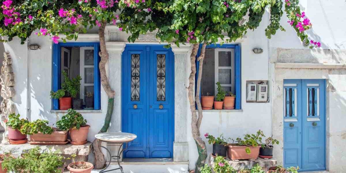 a colorful blue door of a house in the Greek village of Pyrgos