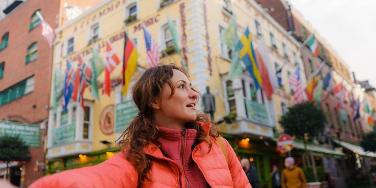 a woman taking a selfie in the middle of Dublin in Ireland